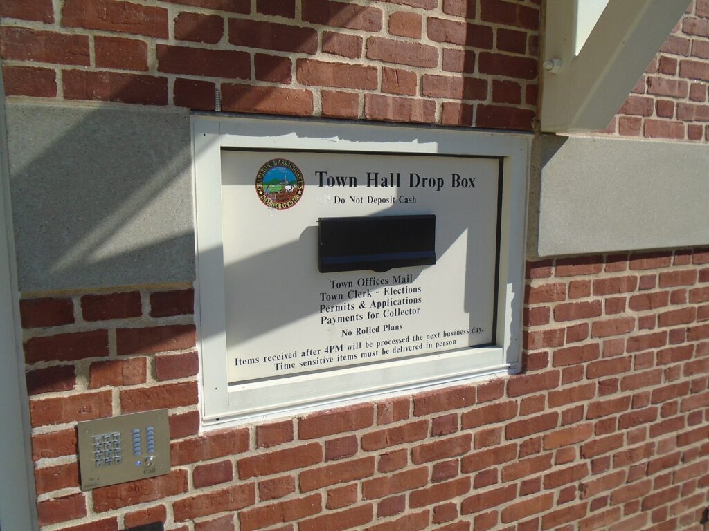 Ballot drop box set in a brick wall